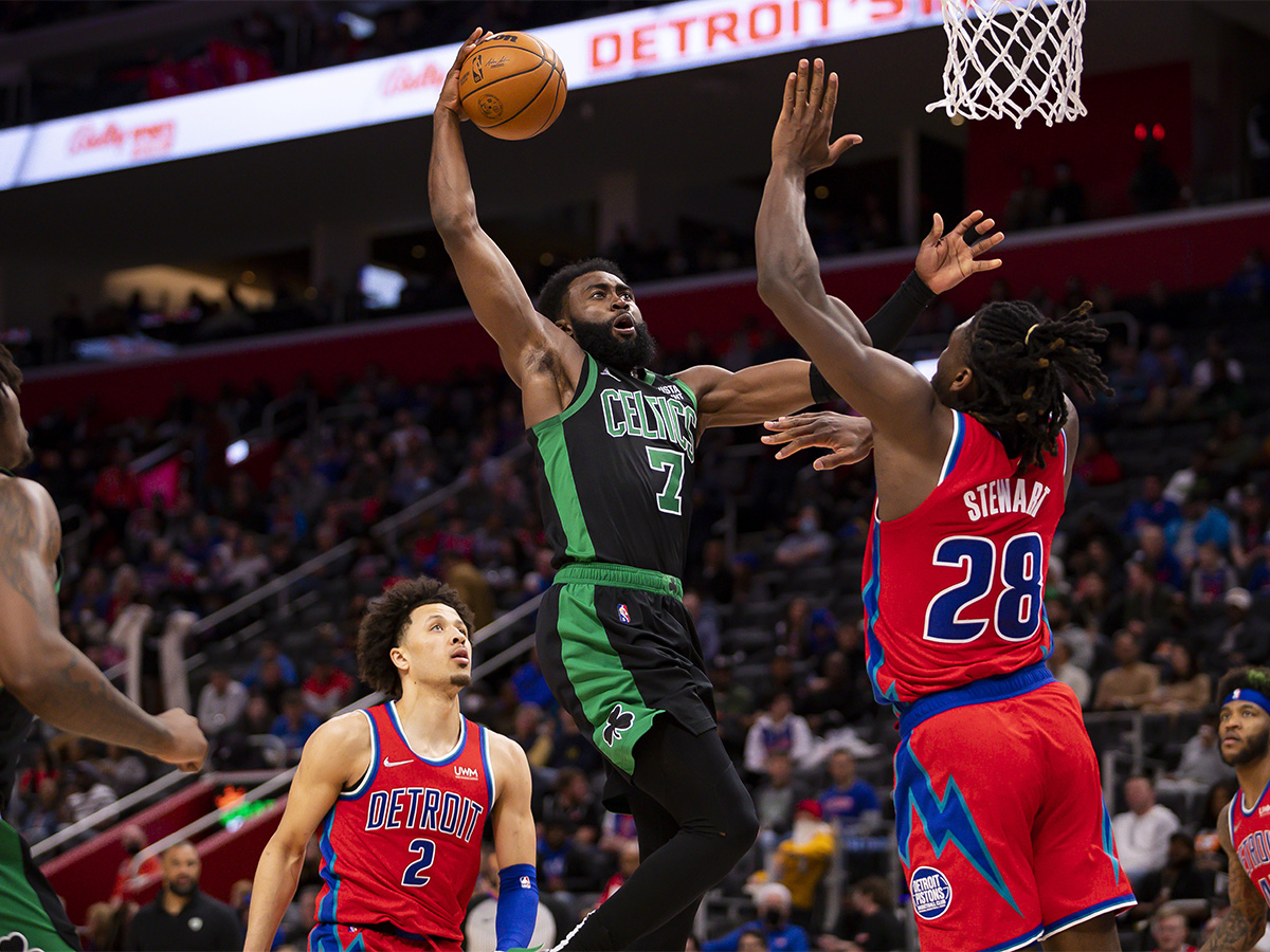 Feb 26, 2022; Detroit, Michigan, USA; Boston Celtics guard Jaylen Brown (7) goes up for a shot against Detroit Pistons center Isaiah Stewart (28) during the third quarter at Little Caesars Arena. Mandatory Credit: Raj Mehta-USA TODAY Sports