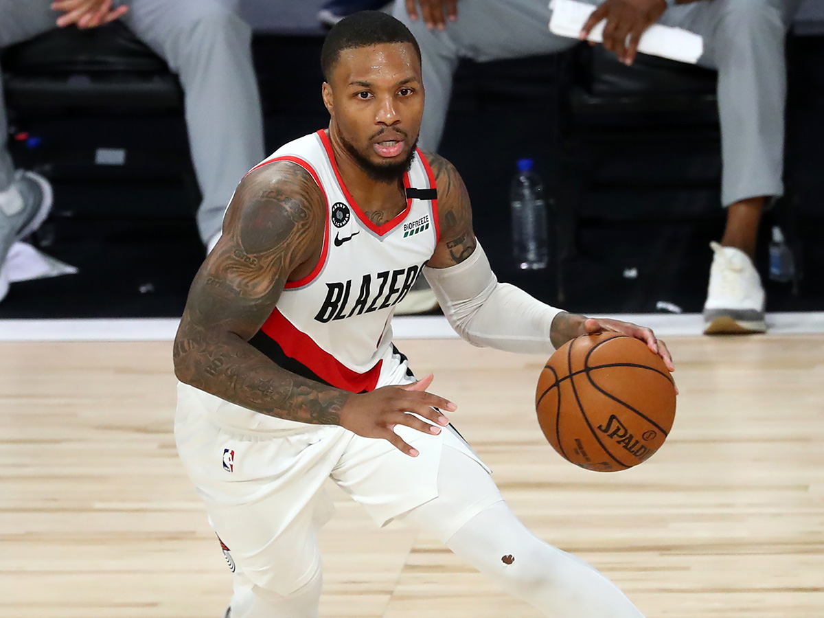 Portland Trail Blazers guard Damian Lillard (0) dribbles during the second half against the LA Clippers in an NBA basketball game at HP Field House at ESPN Wide World Of Sports Complex on August 8, 2020 in Lake Buena Vista, Florida. NOTE TO USER: User expressly acknowledges and agrees that, by downloading and or using this photograph, User is consenting to the terms and conditions of the Getty Images License Agreement. (Photo by Kim Klement-Pool/Getty Images)