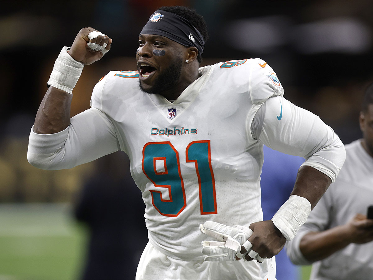 Emmanuel Ogbah #91 of the Miami Dolphins reacts after defeating the at Caesars Superdome on December 27, 2021 in New Orleans, Louisiana. (Photo by Chris Graythen/Getty Images)