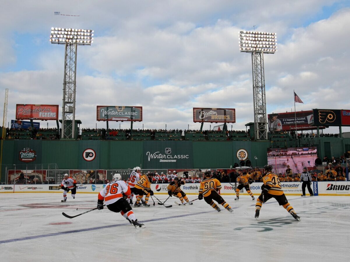 BOSTON - JANUARY 01: The Philadelphia Flyers face off against the Boston Bruins during the 2010 Bridgestone Winter Classic at Fenway Park on January 1, 2010 in Boston, Massachusetts. The Boston Bruins defeated the Philadelphia Flyers 2-1 in overtime. (Photo by Elsa/Getty Images)