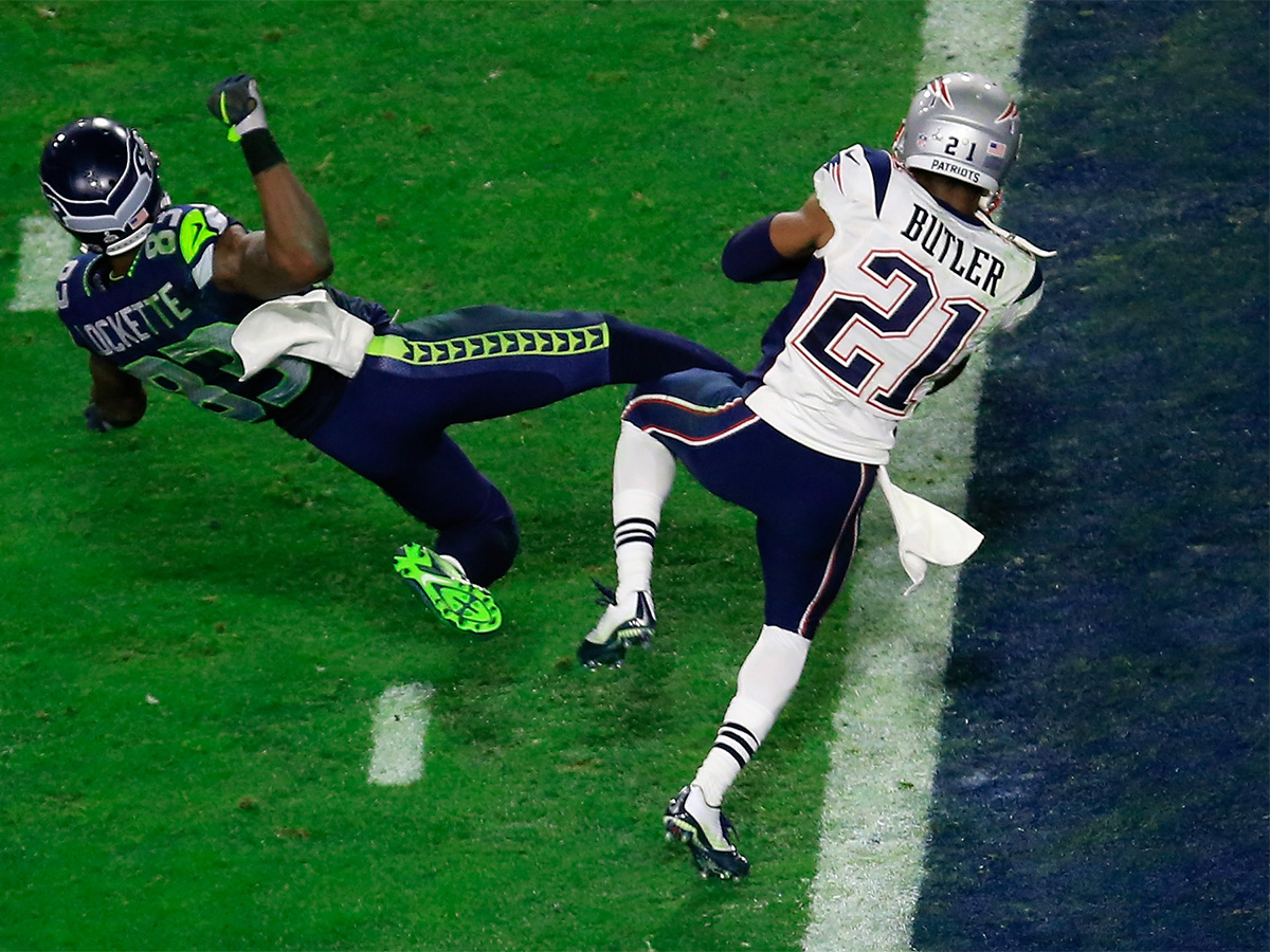 Malcolm Butler #21 of the New England Patriots intercepts a pass by Russell Wilson #3 of the Seattle Seahawks intended for Ricardo Lockette #83 late in the fourth quarter during Super Bowl XLIX at University of Phoenix Stadium on February 1, 2015 in Glendale, Arizona. (Photo by Jamie Squire/Getty Images)