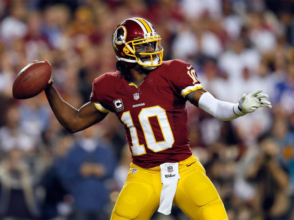 LANDOVER, MD - DECEMBER 03:  Quarterback  Robert Griffin III #10 of the Washington Redskins throws the ball in the first quarter while taking on the New York Giants at FedExField on December 3, 2012 in Landover, Maryland.  (Photo by Rob Carr/Getty Images)