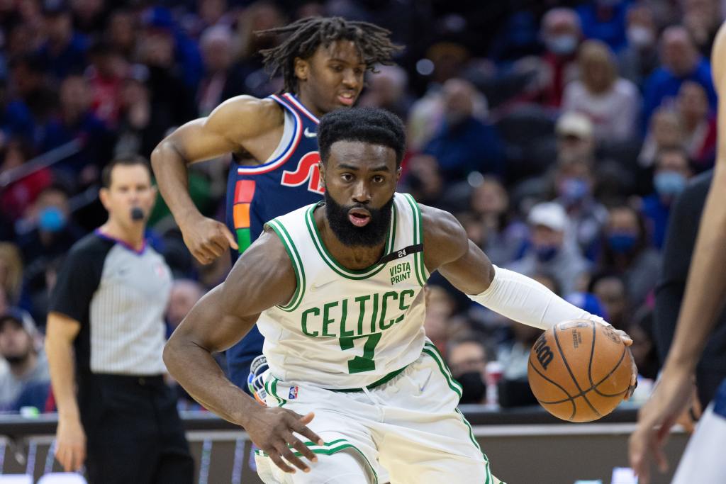 Feb 15, 2022; Philadelphia, Pennsylvania, USA; Boston Celtics guard Jaylen Brown (7) dribbles past Philadelphia 76ers guard Tyrese Maxey (0) during the third quarter at Wells Fargo Center. Mandatory Credit: Bill Streicher-USA TODAY Sports