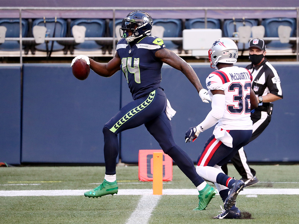 DK Metcalf #14 of the Seattle Seahawks scores a second quarter touchdown against the New England Patriots at CenturyLink Field on September 20, 2020 in Seattle, Washington. (Photo by Abbie Parr/Getty Images)