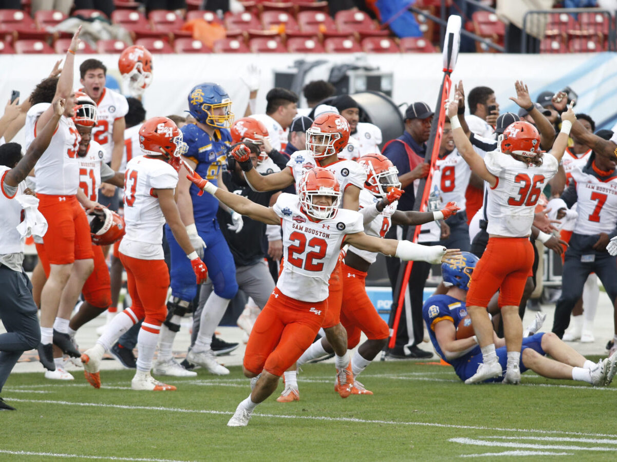 May 16, 2021; Frisco, Texas, USA; Sam Houston State Bearkats defensive back Zyon McCollum (22) and his teammates celebrate winning the game against the South Dakota State Jackrabbits at the Division I FCS Championship football game at Toyota Stadium. Mandatory Credit: Tim Heitman-USA TODAY Sports