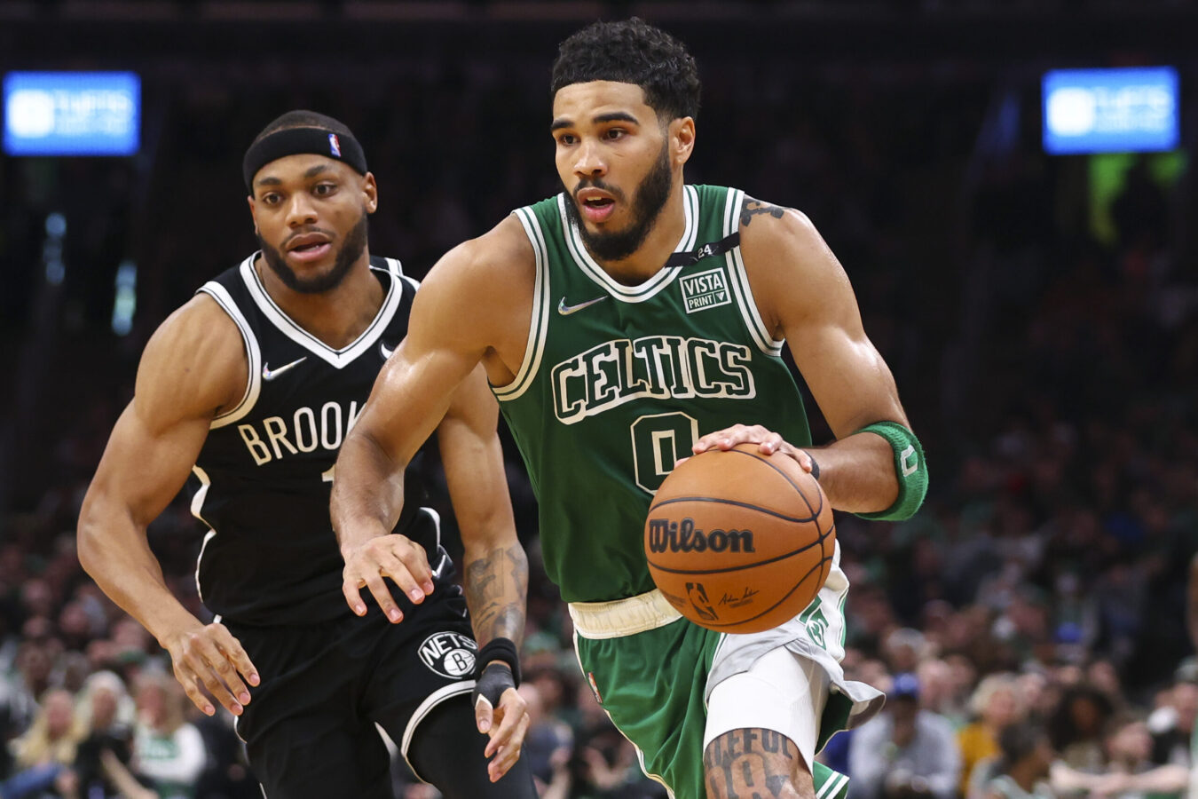 BOSTON, MA - MARCH 06 Jayson Tatum #0 of the Boston Celtics drives to the basket past Bruce Brown #1 of the Brooklyn Nets during a game at TD Garden on March 6, 2022 in Boston, Massachusetts. NOTE TO USER: User expressly acknowledges and agrees that, by downloading and or using this photograph, User is consenting to the terms and conditions of the Getty Images License Agreement. (Photo by Adam Glanzman/Getty Images)