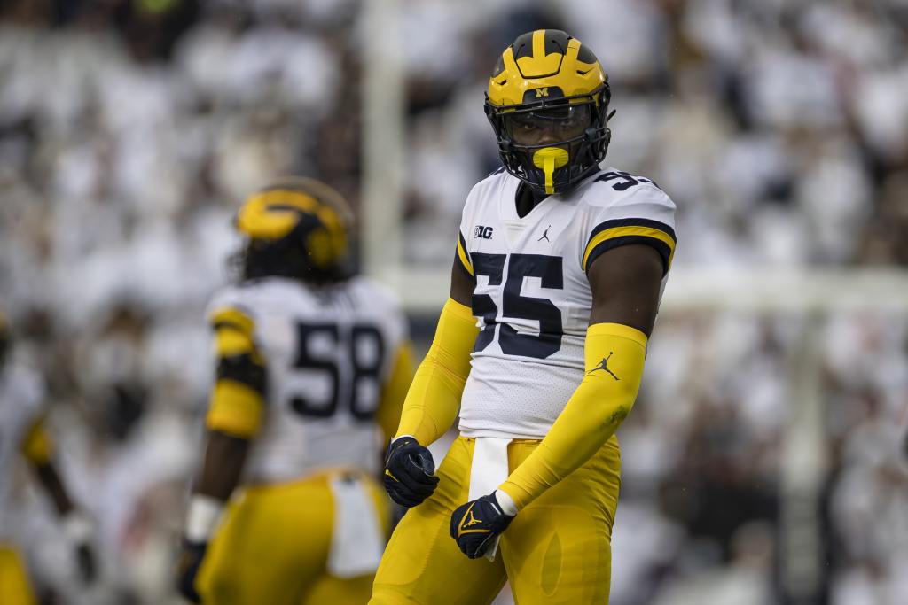 STATE COLLEGE, PA - NOVEMBER 13: David Ojabo #55 of the Michigan Wolverines celebrates after recording a sack against the Penn State Nittany Lions during the first half at Beaver Stadium on November 13, 2021 in State College, Pennsylvania. (Photo by Scott Taetsch/Getty Images)