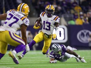 Jan 4, 2022; Houston, TX, USA; LSU Tigers quarterback Jontre Kirklin (13) runs with the ball during the second quarter against the Kansas State Wildcats during the 2022 Texas Bowl at NRG Stadium. Credit: Troy Taormina-USA TODAY Sports