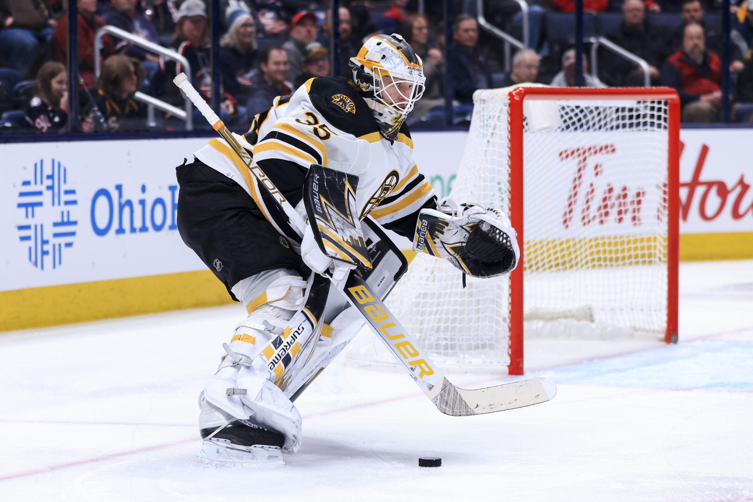 Apr 4, 2022; Columbus, Ohio, USA; Boston Bruins goaltender Linus Ullmark (35) plays the puck against the Columbus Blue Jackets in the first period at Nationwide Arena. Mandatory Credit: Aaron Doster-USA TODAY Sports