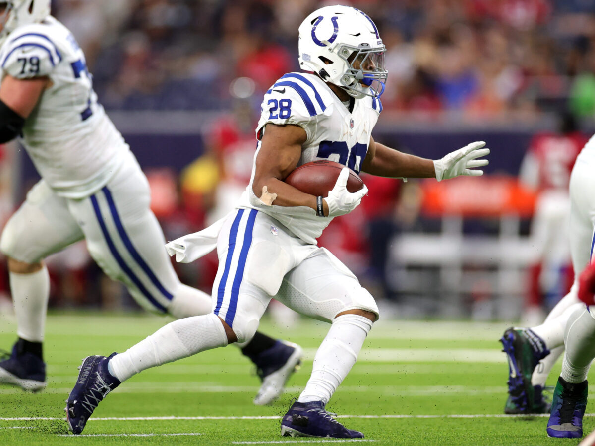 HOUSTON, TEXAS - DECEMBER 05: Jonathan Taylor #28 of the Indianapolis Colts runs the ball during the third quarter against the Houston Texans at NRG Stadium on December 05, 2021 in Houston, Texas. (Photo by Carmen Mandato/Getty Images)