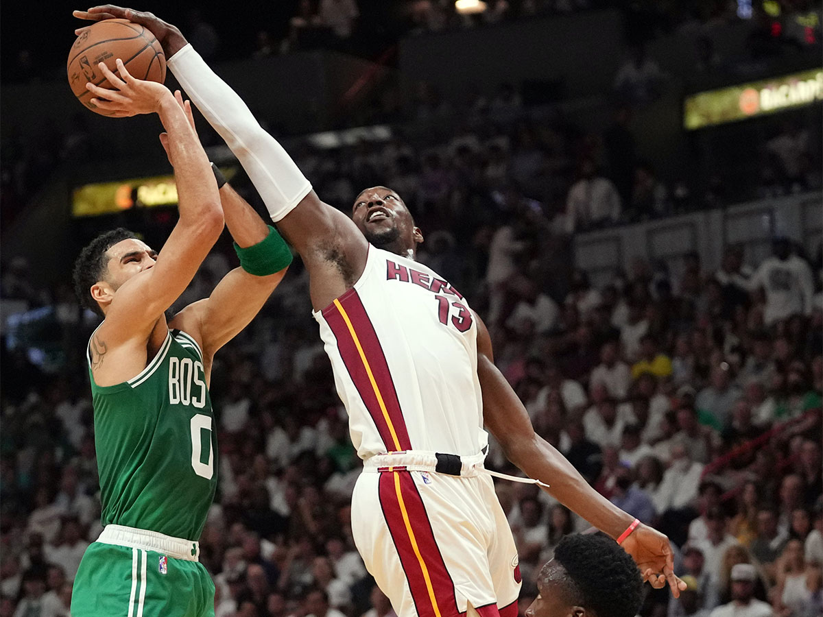 May 17, 2022; Miami, Florida, USA; Boston Celtics forward Jayson Tatum (0) gets blocked by Miami Heat center Bam Adebayo (13) during the first half of game one of the 2022 eastern conference finals at FTX Arena. Mandatory Credit: Jasen Vinlove-USA TODAY Sports