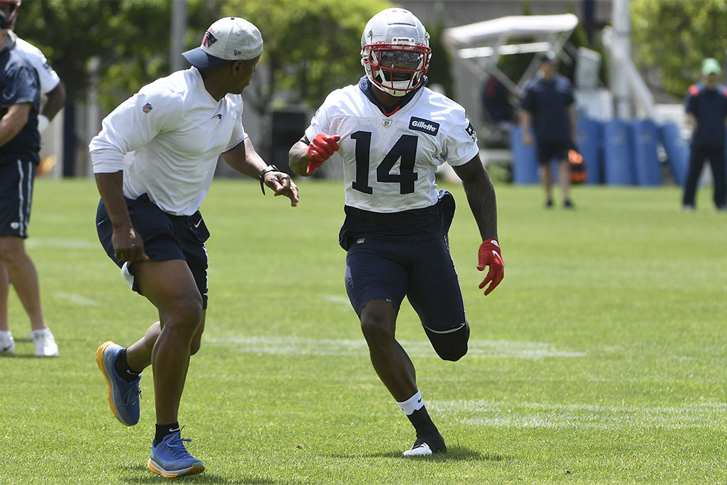 May 23, 2022; Foxborough, MA, USA; New England Patriots wide receiver Ty Montgomery (14) works with assistant coach Troy Brown at the team's OTA at Gillette Stadium. Mandatory Credit: Eric Canha-USA TODAY Sports