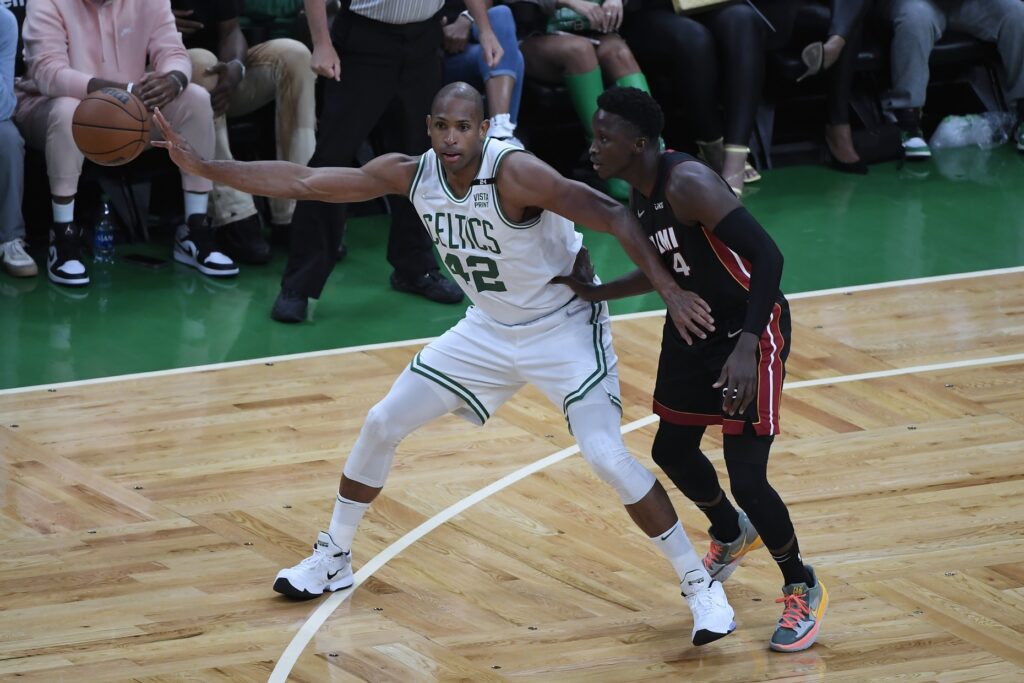 May 23, 2022; Boston, Massachusetts, USA; Boston Celtics center Al Horford (42) moves the ball defended by Miami Heat guard Victor Oladipo (4) in the first half during game four of the 2022 eastern conference finals at TD Garden. Mandatory Credit: Bob DeChiara-USA TODAY Sports