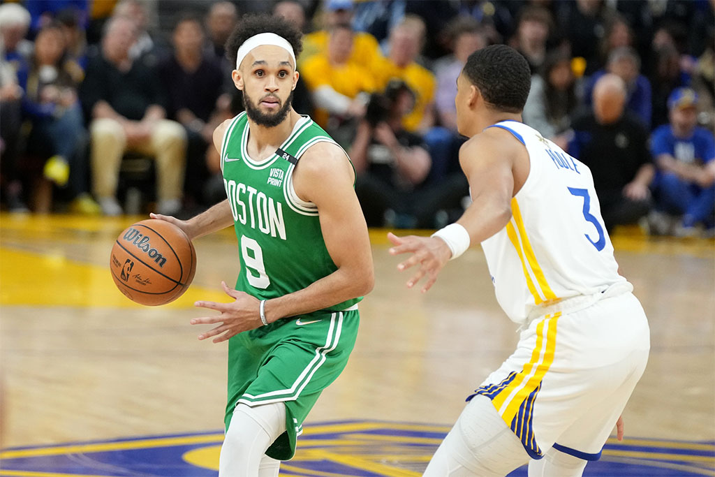 Jun 2, 2022; San Francisco, California, USA; Boston Celtics guard Derrick White (9) dribbles the ball while defended by Golden State Warriors guard Jordan Poole (3) during the second half in game one of the 2022 NBA Finals at Chase Center. Mandatory Credit: Kyle Terada-USA TODAY Sports