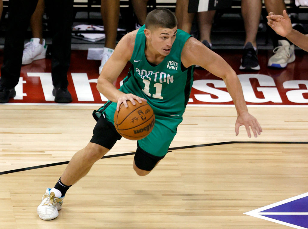 LAS VEGAS, NEVADA - AUGUST 10: Payton Pritchard #11 of the Boston Celtics drives against the Denver Nuggets during the 2021 NBA Summer League at the Thomas & Mack Center on August 10, 2021 in Las Vegas, Nevada. The Celtics defeated the Nuggets 107-82. NOTE TO USER: User expressly acknowledges and agrees that, by downloading and or using this photograph, User is consenting to the terms and conditions of the Getty Images License Agreement. (Photo by Ethan Miller/Getty Images)