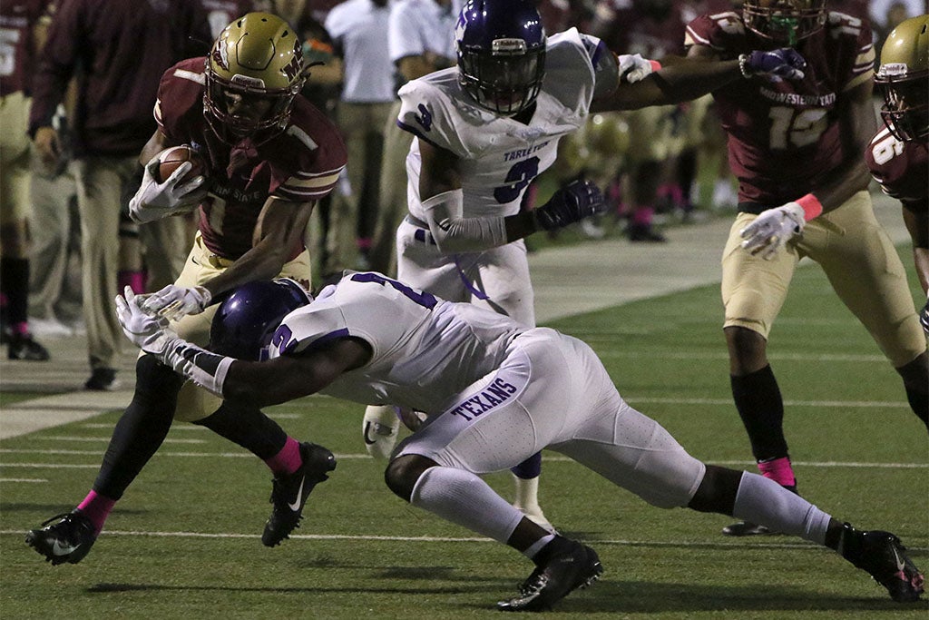 Midwestern State's Tyrique Edwards is hit out of bounds by Tarleton's Devin Hafford Saturday, Oct. 27, 2018, at Memorial Stadium. The Mustangs lost in overtime to the Texans 35-34 after a missed field goal. (Lauren Roberts/Times Record News)