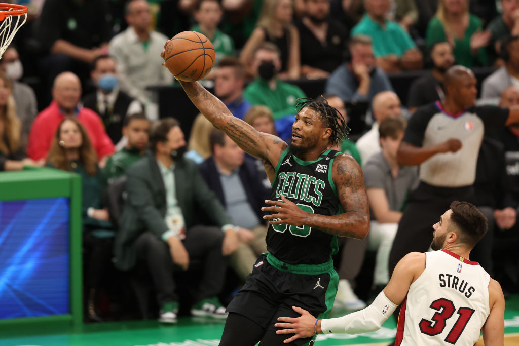 BOSTON, MASSACHUSETTS - MAY 27: Marcus Smart #36 of the Boston Celtics shoots against Max Strus #31 of the Miami Heat during the first quarter in Game Six of the 2022 NBA Playoffs Eastern Conference Finals at TD Garden on May 27, 2022 in Boston, Massachusetts. NOTE TO USER: User expressly acknowledges and agrees that, by downloading and/or using this photograph, User is consenting to the terms and conditions of the Getty Images License Agreement. (Photo by Maddie Meyer/Getty Images)