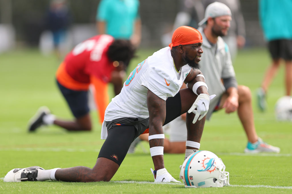 MIAMI GARDENS, FLORIDA - JULY 27: Mohamed Sanu Sr. #16 of the Miami Dolphins stretches during training camp at Baptist Health Training Complex on July 27, 2022 in Miami Gardens, Florida. (Photo by Michael Reaves/Getty Images)
