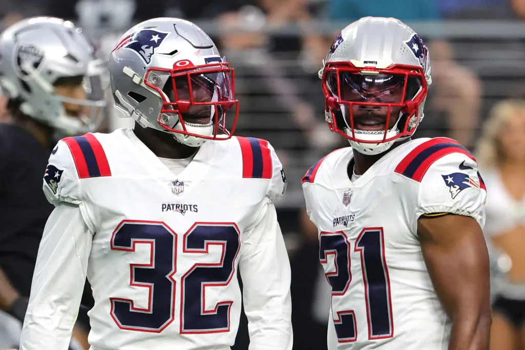 LAS VEGAS, NEVADA - AUGUST 26: Safeties Devin McCourty #32 and Adrian Phillips #21 of the New England Patriots stand on the field between plays against the Las Vegas Raiders during their preseason game at Allegiant Stadium on August 26, 2022 in Las Vegas, Nevada. The Raiders defeated the Patriots 23-6. (Photo by Ethan Miller/Getty Images)