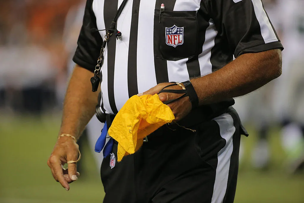 American Football Referee throwing a Penalty Flag , USA Stock