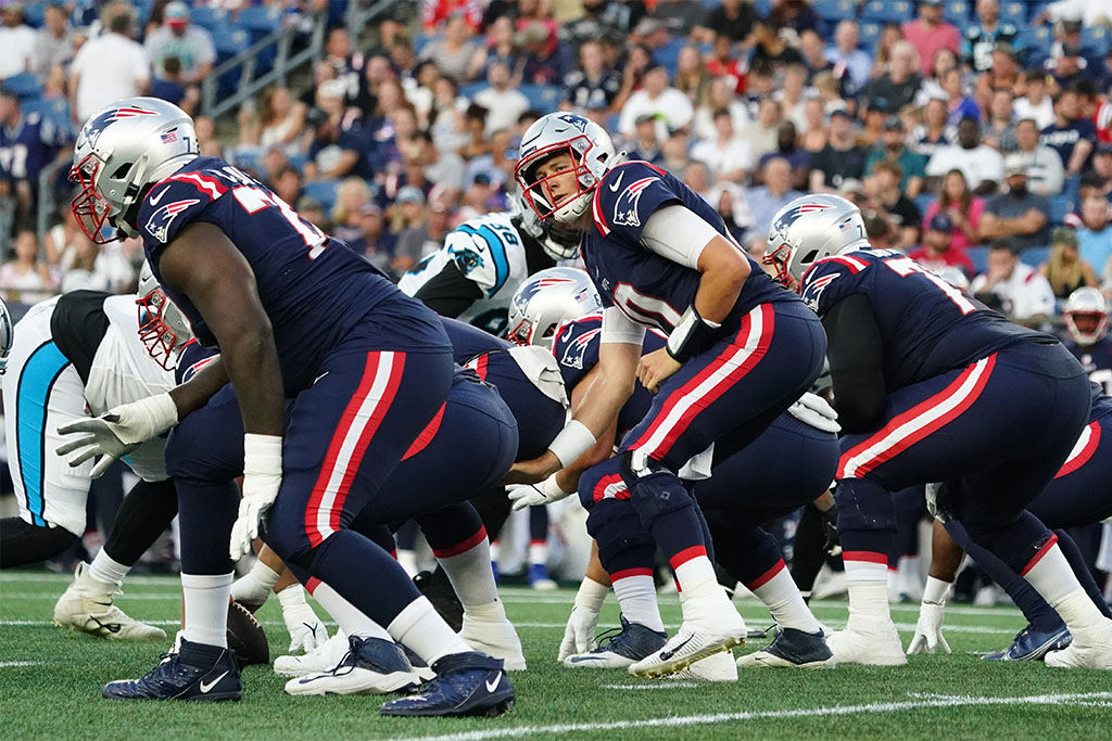 Aug 19, 2022; Foxborough, Massachusetts, USA; New England Patriots quarterback Mac Jones (10) at the line of scrimmage against the Carolina Panthers in the first quarter at Gillette Stadium. Mandatory Credit: David Butler II-USA TODAY Sports