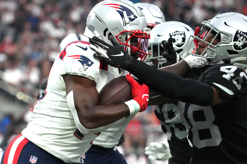 Aug 26, 2022; Paradise, Nevada, USA; New England Patriots wide receiver Ty Montgomery (left) is called for a facemask penalty against Las Vegas Raiders cornerback Sam Webb (48) in the first quarter at Allegiant Stadium. Mandatory Credit: Kirby Lee-USA TODAY Sports