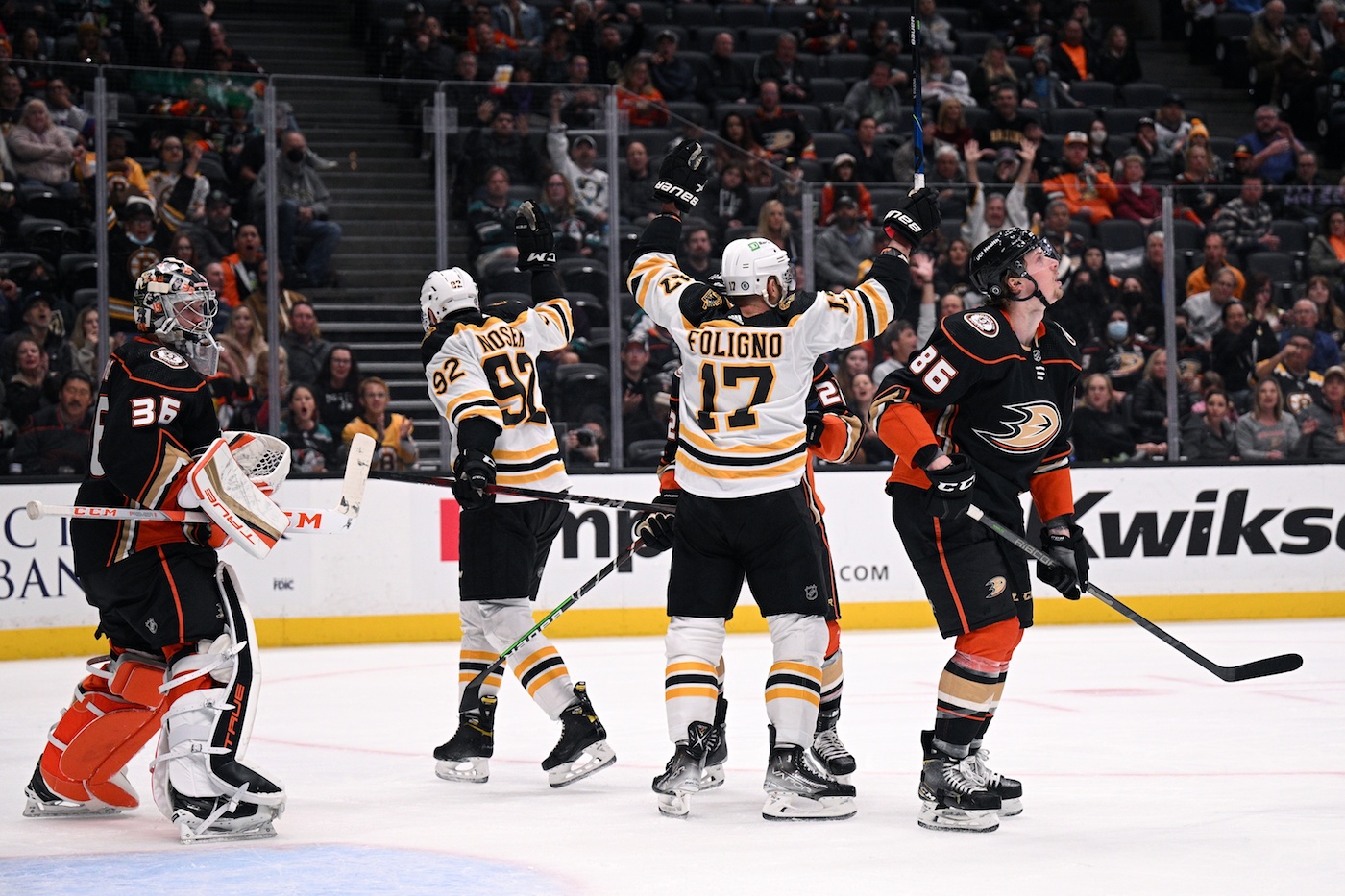 Mar 1, 2022; Anaheim, California, USA; Boston Bruins left wing Nick Foligno (17) and center Tomas Nosek (92) celebrate after a goal scored by defenseman Brandon Carlo (not pictured) past Anaheim Ducks goaltender John Gibson (36) during the second period at Honda Center. Mandatory Credit: Orlando Ramirez-USA TODAY Sports