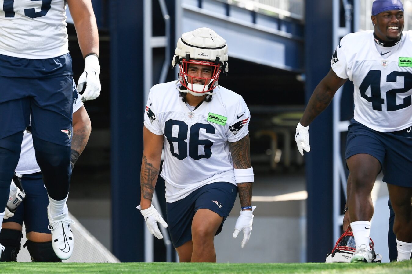 Jul 30, 2022; Foxborough, MA, USA; New England Patriots tight end Devin Asiasi (86) heads to the practice field at the Patriots training camp at Gillette Stadium. Mandatory Credit: Eric Canha/USA TODAY Sports