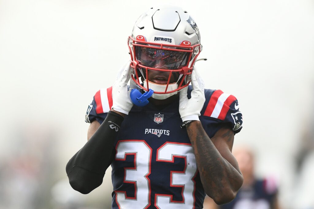 Aug 11, 2022; Foxborough, Massachusetts, USA; New England Patriots cornerback Joejuan Williams (33) walks onto the field before a preseason game against the New York Giants at Gillette Stadium. Credit: Brian Fluharty-USA TODAY Sports