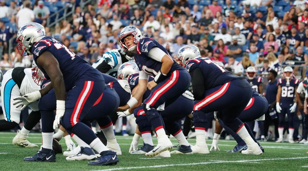 Aug 19, 2022; Foxborough, Massachusetts, USA; New England Patriots quarterback Mac Jones (10) at the line of scrimmage against the Carolina Panthers in the first quarter at Gillette Stadium. Credit: David Butler II-USA TODAY Sports