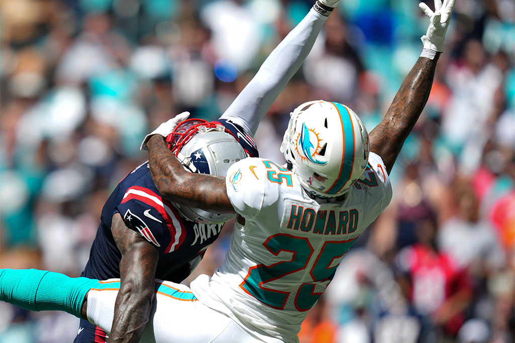 Sep 11, 2022; Miami Gardens, Florida, USA; Miami Dolphins cornerback Xavien Howard (25) breaks up a pass to New England Patriots wide receiver DeVante Parker (1) during the second half at Hard Rock Stadium. Mandatory Credit: Jasen Vinlove-USA TODAY Sports