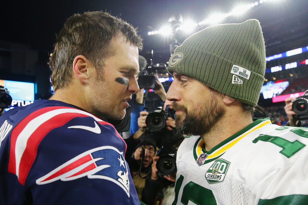 FOXBOROUGH, MA - NOVEMBER 04: Tom Brady #12 of the New England Patriots talks with Aaron Rodgers #12 of the Green Bay Packers after the Patriots defeated the Packers 31-17 at Gillette Stadium on November 4, 2018 in Foxborough, Massachusetts. (Photo by Maddie Meyer/Getty Images)