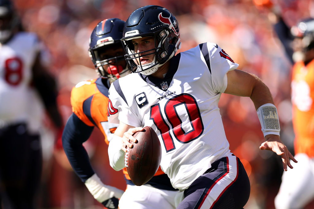 DENVER, COLORADO - SEPTEMBER 18: Davis Mills #10 of the Houston Texans carries the ball in the second quarter of the game against the Denver Broncos at Empower Field At Mile High on September 18, 2022 in Denver, Colorado. (Photo by Matthew Stockman/Getty Images)
