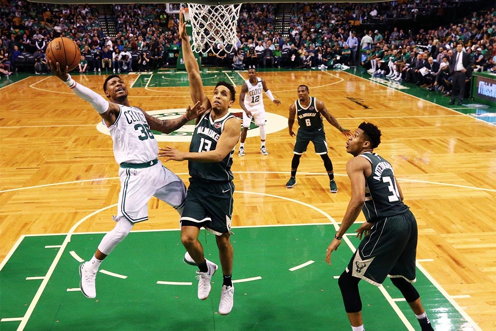 BOSTON, MA - APRIL 28: Marcus Smart #36 of the Boston Celtics takes a shot against Malcolm Brogdon #13 of the Milwaukee Bucks in Game Seven of Round One of the 2018 NBA Playoffs at TD Garden on April 28, 2018 in Boston, Massachusetts. The Celtics defeat the Bucks 112-96. (Photo by Maddie Meyer/Getty Images)