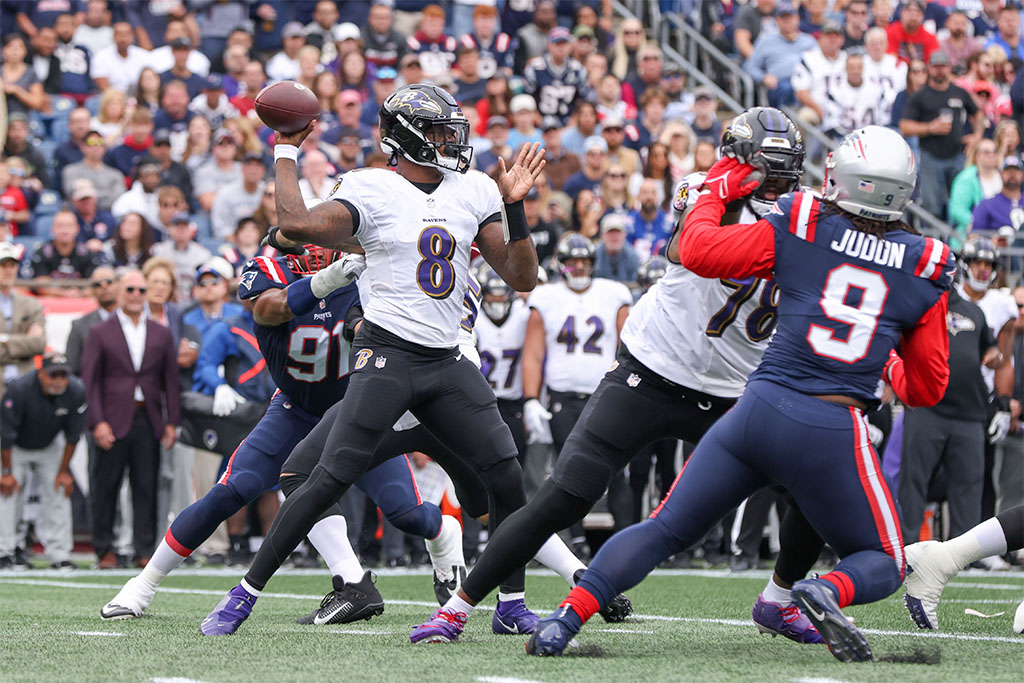 Sep 25, 2022; Foxborough, Massachusetts, USA; Baltimore Ravens quarterback Lamar Jackson (8) passes the ball the ball during the first half against the New England Patriots at Gillette Stadium. Mandatory Credit: Paul Rutherford-USA TODAY Sports