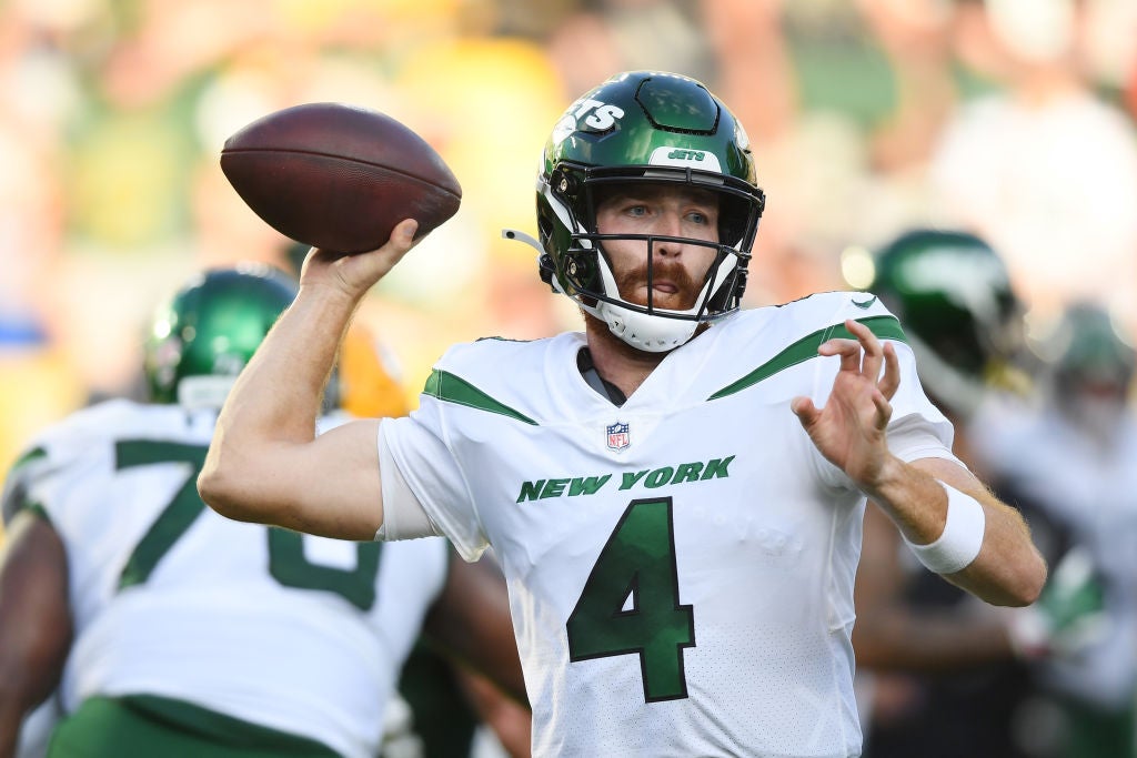 GREEN BAY, WISCONSIN - AUGUST 21: James Morgan #4 of the New York Jets passes the football in the second half during a preseason game against the Green Bay Packers at Lambeau Field on August 21, 2021 in Green Bay, Wisconsin. (Photo by Quinn Harris/Getty Images)