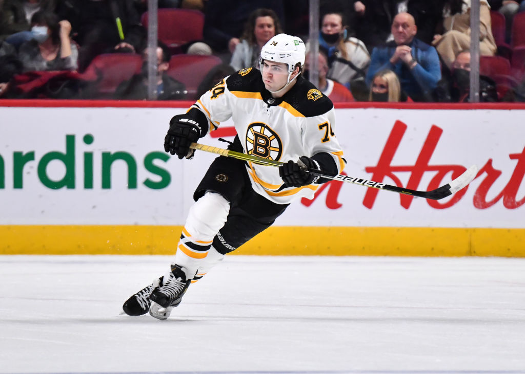 MONTREAL, QC - MARCH 21: Jake DeBrusk #74 of the Boston Bruins skates against the Montreal Canadiens during the third period at Centre Bell on March 21, 2022 in Montreal, Canada. The Boston Bruins defeated the Montreal Canadiens 3-2 in overtime. (Photo by Minas Panagiotakis/Getty Images)