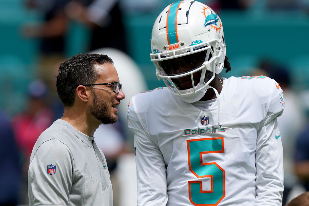 MIAMI GARDENS, FLORIDA - SEPTEMBER 11: Head coach Mike McDaniel and Teddy Bridgewater #5 of the Miami Dolphins talks before the game against the New England Patriots at Hard Rock Stadium on September 11, 2022 in Miami Gardens, Florida. (Photo by Eric Espada/Getty Images)