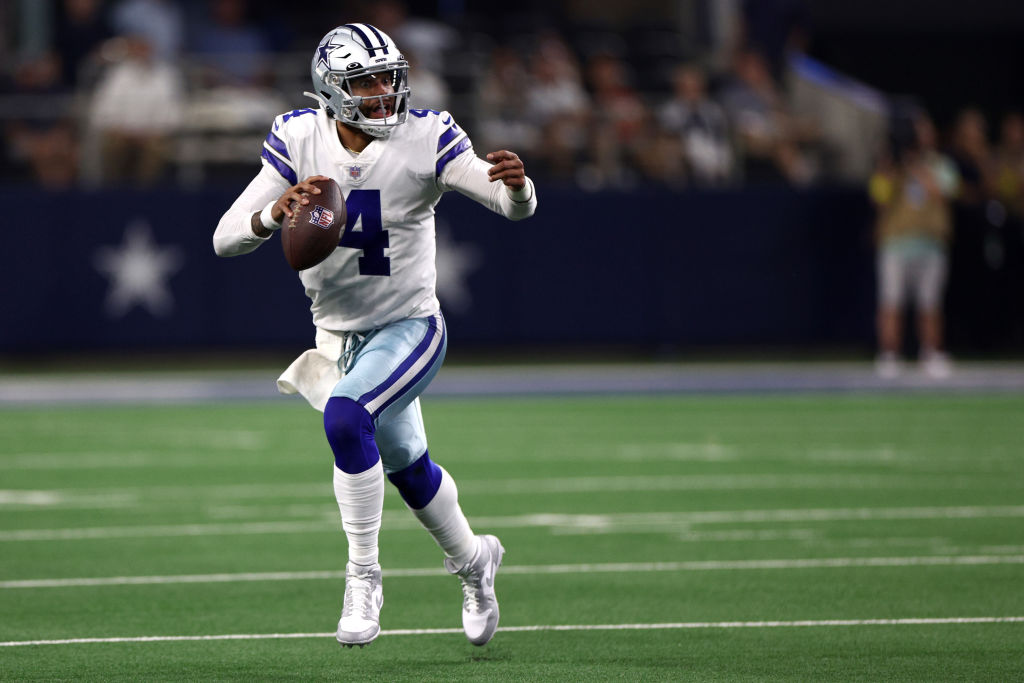 ARLINGTON, TEXAS - SEPTEMBER 11: Dak Prescott #4 of the Dallas Cowboys carries the ball against the Tampa Bay Buccaneers during the second half at AT&T Stadium on September 11, 2022 in Arlington, Texas. (Photo by Tom Pennington/Getty Images)