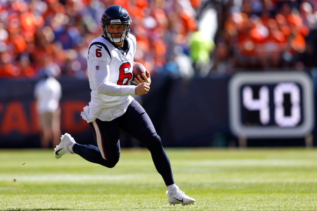 DENVER, COLORADO - SEPTEMBER 18: Jeff Driskel #6 of the Houston Texans rushes for a first down during the first quarter against the Denver Broncos at Empower Field At Mile High on September 18, 2022 in Denver, Colorado. (Photo by Justin Edmonds/Getty Images)