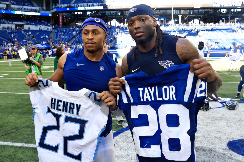 INDIANAPOLIS, INDIANA - OCTOBER 02: Jonathan Taylor #28 of the Indianapolis Colts and Derrick Henry #22 of the Tennessee Titans poses with each other's jersey after Tennessee's 24-17 win at Lucas Oil Stadium on October 02, 2022 in Indianapolis, Indiana. (Photo by Justin Casterline/Getty Images)