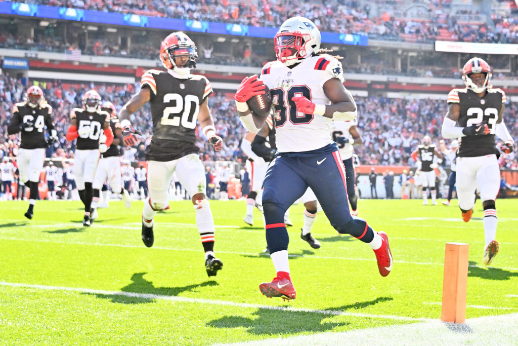 CLEVELAND, OHIO - OCTOBER 16: Rhamondre Stevenson #38 of the New England Patriots runs past Greg Newsome II #20 of the Cleveland Browns while scoring a touchdown during the second quarter at FirstEnergy Stadium on October 16, 2022 in Cleveland, Ohio. (Photo by Jason Miller/Getty Images)