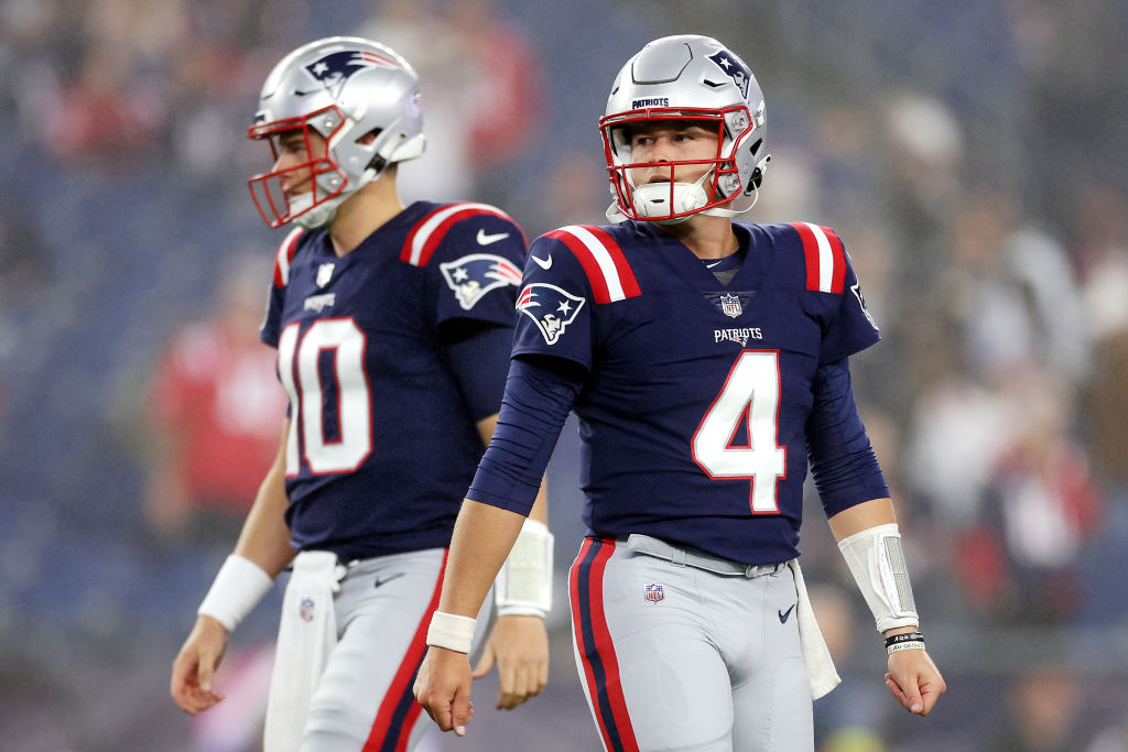FOXBOROUGH, MASSACHUSETTS - OCTOBER 24: Mac Jones #10 and Bailey Zappe #4 of the New England Patriots stand on the field prior to the game against the Chicago Bears at Gillette Stadium on October 24, 2022 in Foxborough, Massachusetts. (Photo by Maddie Meyer/Getty Images)