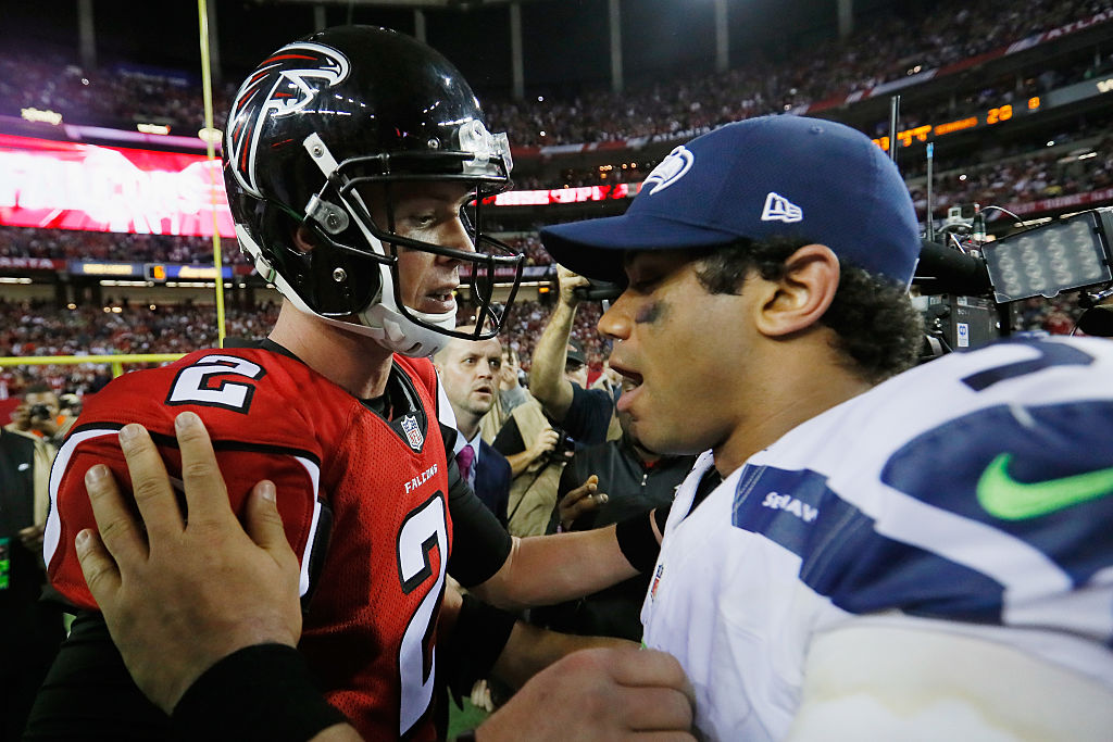 ATLANTA, GA - JANUARY 14: Matt Ryan #2 of the Atlanta Falcons and Russell Wilson #3 of the Seattle Seahawks meet on the field after the Atlanta Falcons win at the Georgia Dome on January 14, 2017 in Atlanta, Georgia. (Photo by Kevin C. Cox/Getty Images)