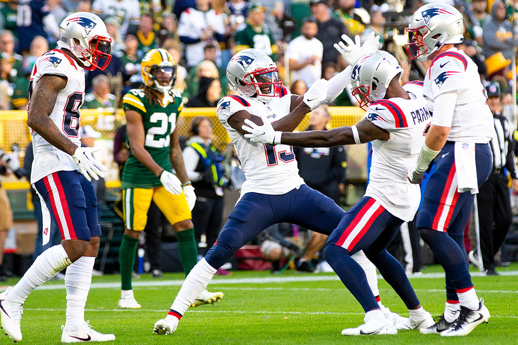 New England Patriots wide receiver Kendrick Bourne (84), wide receiver Nelson Agholor (15), wide receiver DeVante Parker (1), and quarterback Bailey Zappe (4) celebrate in the second half of the game on Sunday, Oct. 2, 2022, at Lambeau Field in Green Bay, Wisconsin. (Samantha Madar/USA TODAY NETWORK)