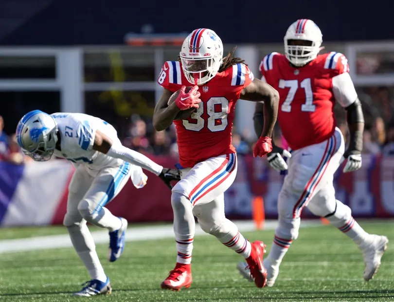 Patriots running back #38 Rhamondre Stevenson runs for a big gain after getting a block from #71 Mike Onwenu in the 4th. (Bob Breidenbach/USA TODAY NETWORK)