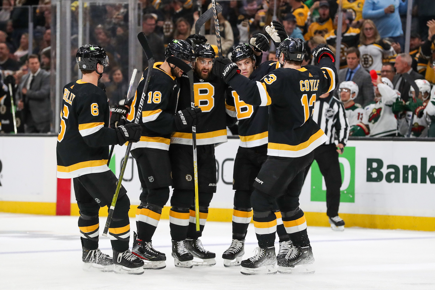 Oct 22, 2022; Boston, Massachusetts, USA; Boston Bruins left wing Nick Foligno (17) celebrates with teammates after scoring during the first period against the Minnesota Wild at TD Garden. Mandatory Credit: Paul Rutherford/USA TODAY Sports