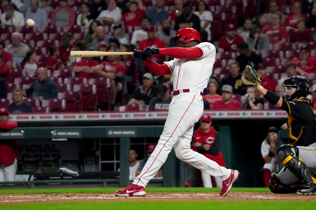 CINCINNATI, OHIO - SEPTEMBER 12: Aristides Aquino #44 of the Cincinnati Reds hits a two-run home run in the fourth inning against the Pittsburgh Pirates at Great American Ball Park on September 12, 2022 in Cincinnati, Ohio. (Photo by Dylan Buell/Getty Images)