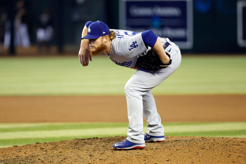 PHOENIX, ARIZONA - SEPTEMBER 14: Pitcher Craig Kimbrel #46 of the Los Angeles Dodgers takes the sign in the 10th inning against the Arizona Diamondbacks at Chase Field on September 14, 2022 in Phoenix, Arizona. (Photo by Chris Coduto/Getty Images)