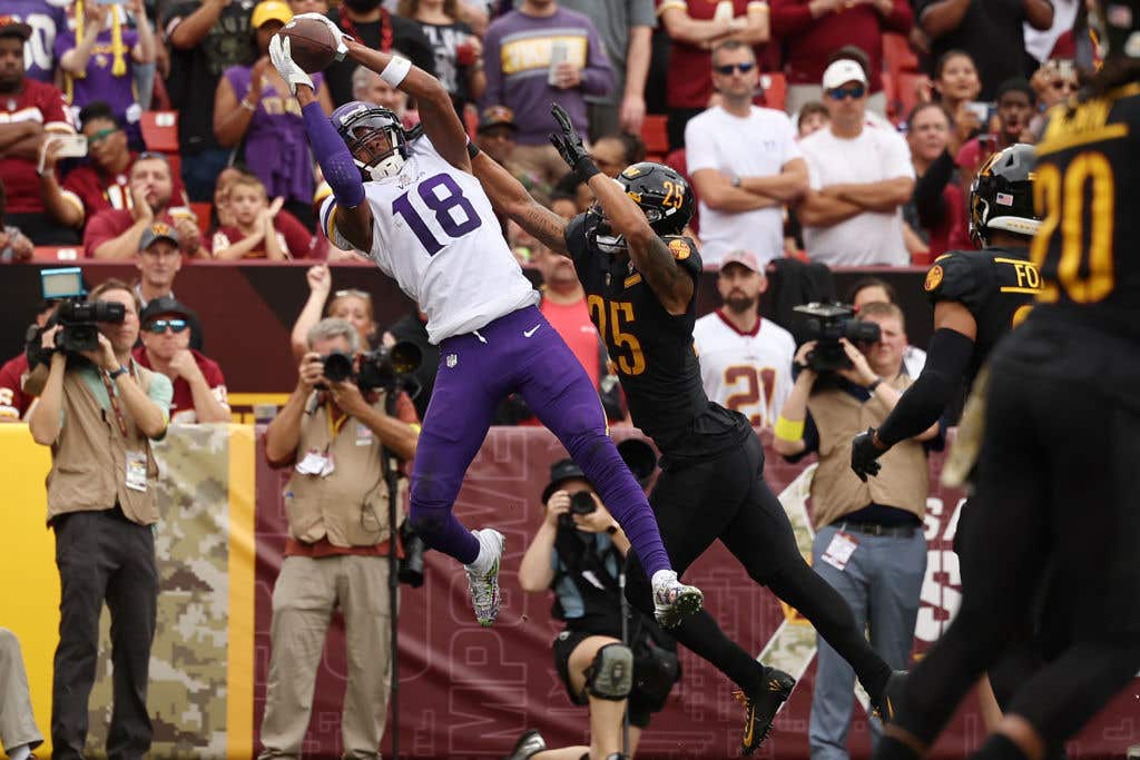 LANDOVER, MARYLAND - NOVEMBER 06: Justin Jefferson #18 of the Minnesota Vikings catches a pass for a touchdown in the first quarter of the game against the Washington Commanders at FedExField on November 06, 2022 in Landover, Maryland. (Photo by Scott Taetsch/Getty Images)